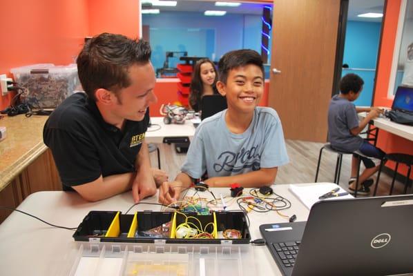 "Creative Robotics" program in action in the "Newton Room" at the STEM Center USA Robotics Creativity Center