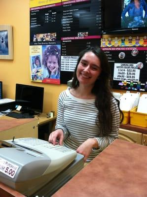 Wonderful employee Ashley ringing up one of the many loyal customers!