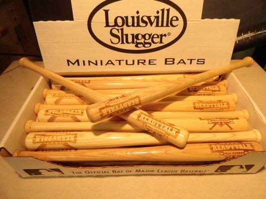 Custom engraved mini-bats for advertising.