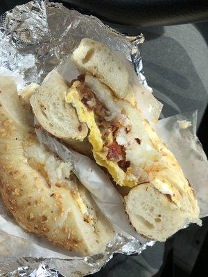 Bacon egg and cheese hash brown on the onion bagel