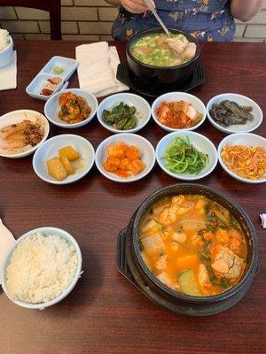 Banchan assortment, al tang (fish roe soup) at bottom, dogani tang (beef tendon soup) at top