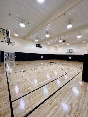 Our Indoor Basketball Gym is a multi-use space for exercise classes, Youth Sports, and is also available for Open Pickleball and Basketball