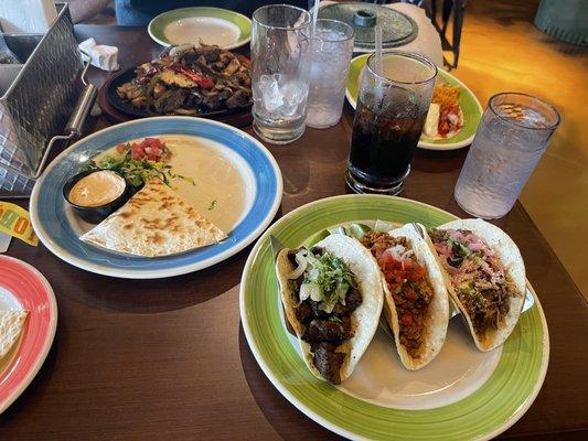 Barbacoa taco, chorizo taco, carne asada taco, chicken and steak fajita, and chicken tinga