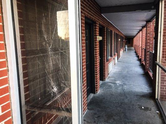 Smashed glass outside the rooms.