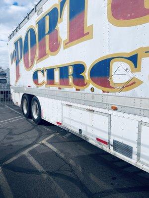 Circus trailer back in the road.