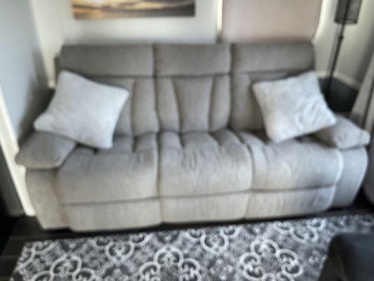 Reclining Sofa with a drop down table.