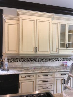 Pinstripe kitchen cabinets with glazing