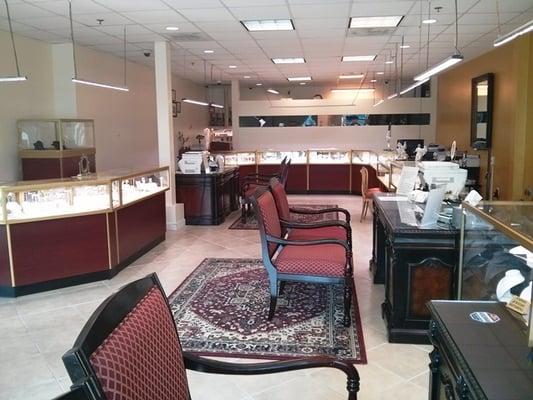 Spacious, elegant interior with various jewelry stations.