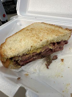 The Sarge described as a pastrami and mustard on sourdough rye.