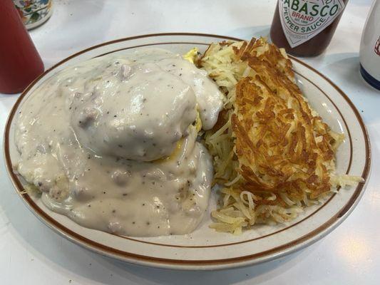 Biscuit with gravy, hash browns on the side