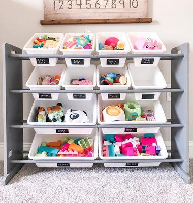 Organized play room, with custom handlettered labels