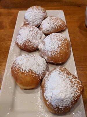 Beignets with Powdered Sugar topping. Came with Honey or Optional Sweet Cream Sauce