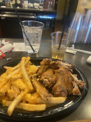 Old bay wings, cheese fries, and bourbon