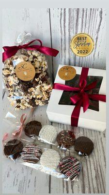 A gift assortment of Mrs. Palmer's Popcorn, our gift boxed chocolate dipped strawberries, and our signature Oreos.