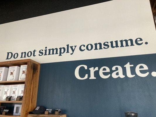 Do not simply consume. Create. Sign at store entrance: