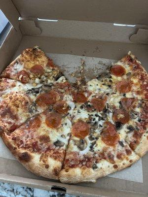 A medium $30 pizza with hardly any of the 4 toppings I ordered.