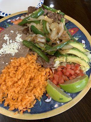 Steak plate dinner comes with side of tortillas.