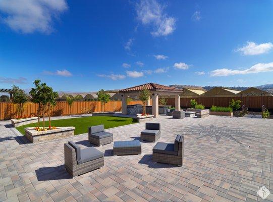 6000 SQ FT paver project featuring custom paver compass, outdoor kitchen, artificial turf lawn and fire pit with paver seating area