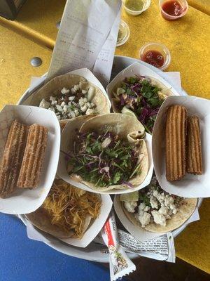 Churro, Brisket Taco, Bacon Breakfast Taco, Shrimp Taco and Fish Taco