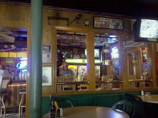 View from main dining area into bar when standing at front door.