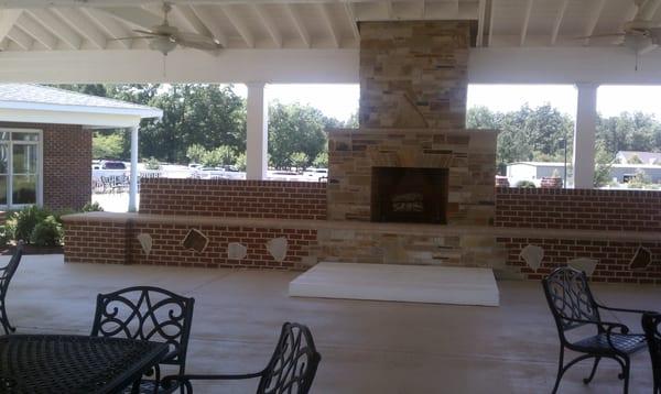 Fireplace under the shelter. This must be a great place to get the chill off after a round on a winter day