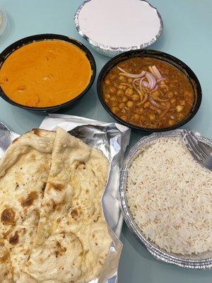 Garlic naan, butter chicken, and chana masala