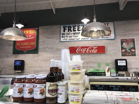 Behind the meat counter