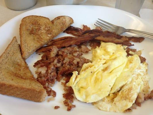 Two eggs, hash (hash is not hash browns) and bacon