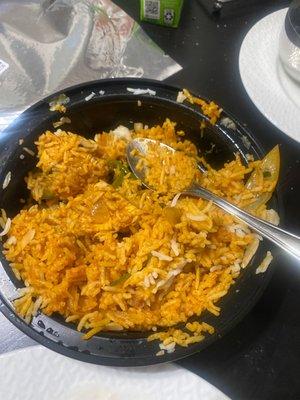 The sad chicken biryani ($17.12) begging to be thrown into a trash! Uncooked chicken is a health hazard.