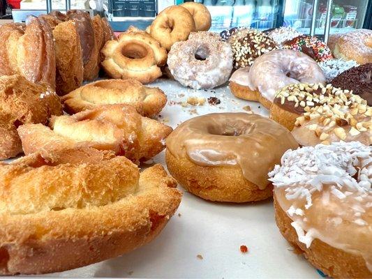 Donuts in their display case.