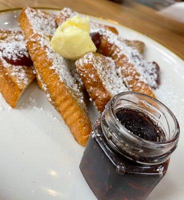 Brown Butter French Toast Whipped butter, strawberry cardamom jam, Paul Family Farm's maple syrup.