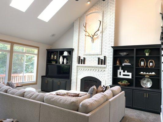 Family room AFTER. Love the brick fireplace. We had new windows put in so the frames get painted in a few weeks.