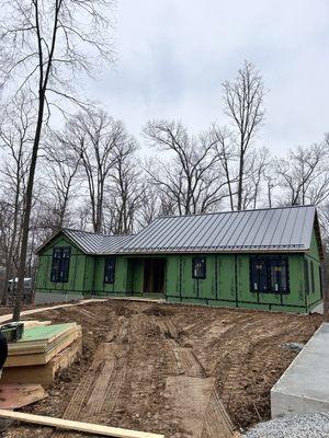 24 Gauge standing seam finish on the house.  Garage is next!