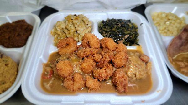 3.Crawfish ettouffee Supreme (ettouffee over cornbread dressing with fried shrimp, Broccoli cheddar cheese, and mustard green.