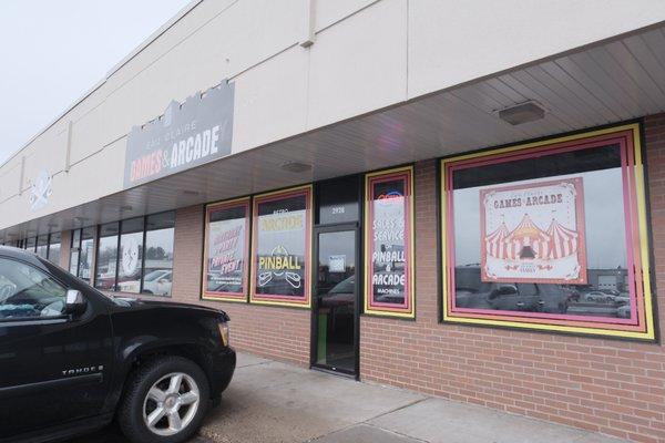 Storefront next to Olympic flame and across from the back lot of eau Claire auto