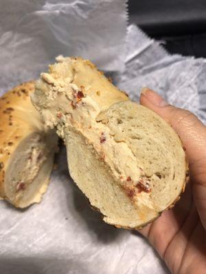 Onion bagel with sun dried tomato spread