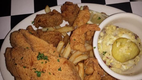 Seafood platter...Oysters, catfish, shrimp, fries, & potato salad.