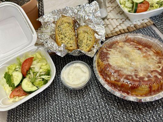 Lasagna with side salad and garlic bread