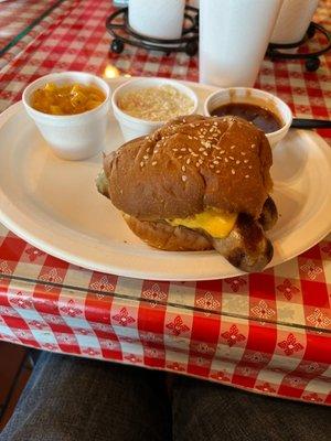 Cheese brat sandwich, sides of Mac cheese and cole slaw