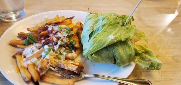 Double cheddar bacon burger (lettuce wrapped) and side of loaded fries.