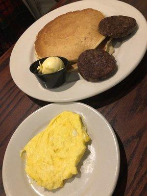 2 buttermilk pancakes with sausage and eggs