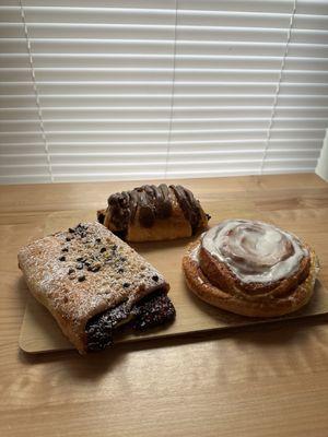 Cinnamon roll plus 2 others that I didn't catch the name of