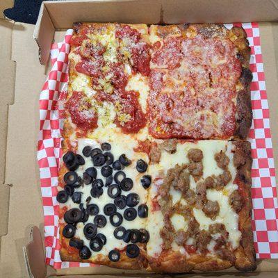 Custom Half Pie: Grandma's slice (top left), Upside Down slice (top right), Sausage slice (right bottom), Black Olive (left bottom).