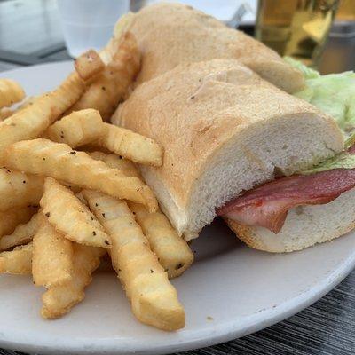 Italian sub sandwich and fries.