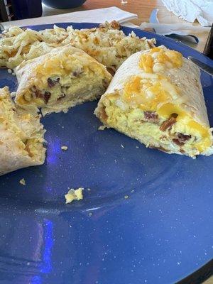 Inside the burrito bursting with eggs, bacon and cheese