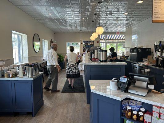 Coffee bar area and area with milks/sugars/add-ins and condiments