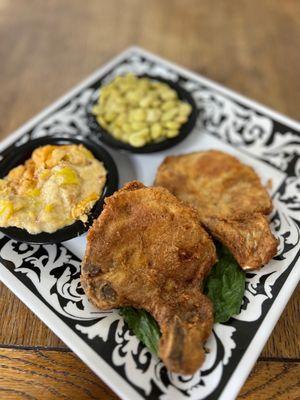 Pork chops, squash casserole, and Lima beans.