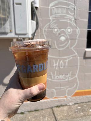 Delicious coffee with a little cookie on top