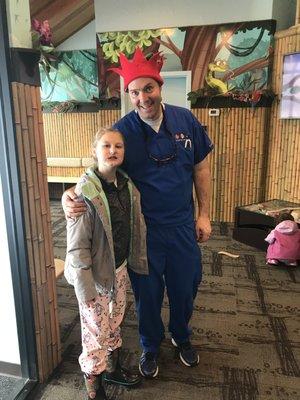 Dr.Rencher With my daughter after pulling two teeth. He is very kind, humble, and great with kids. My daughter and I like him a lot.