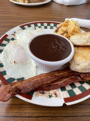 Eggs, bacon, hash brown casserole, biscuits, and chocolate gravy.